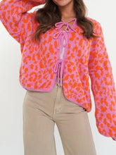 Vibrant leopard print tie-front cardigan in pink and orange
