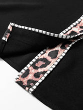Black puff sleeve blouse with leopard trim puff and pink black leopard print trim accented by white gray striped border