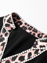 Black leopard trim puff sleeve blouse with pink and black leopard print collar and white gray striped trim