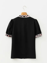Black puff sleeve blouse with leopard trim puff collar and cuffs accented by delicate white beads