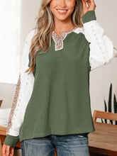 Olive green ribbed long-sleeve top with white lace and leopard trim raglan sleeves for stylish wear