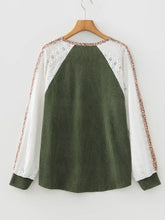 Olive green corduroy long-sleeved top with white lace leopard trim raglan sleeves in a leopard trim raglan style