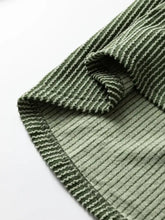 Olive green ribbed corduroy leopard trim raglan sleeve top with textured wavy stripe pattern on fabric