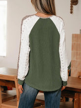 Olive green ribbed knit top with raglan sleeves featuring white lace and leopard trim raglan detail