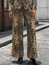 Leopard wide-leg jeans featuring a tan and dark brown leopard print made from soft fabric