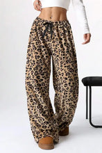 Leopard wide leg pants with drawstring waist and brown leather boots
