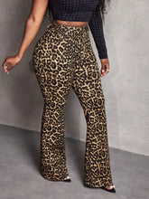Leopard wide leg pants with high waist flared design featuring bold brown and black spots on tan fabric