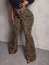 Leopard wide leg pants featuring a bold tan and black leopard print pattern with a flared silhouette