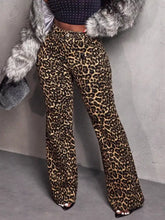 Leopard wide leg pants with bold brown and black spots made from stretchy fabric for comfortable wear