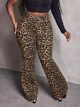 Leopard wide leg pants in high-waisted flared style with bold tan and black stretchy leopard print fabric
