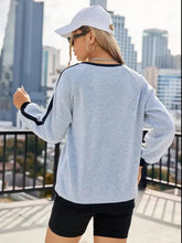 Light gray letter round neck long sleeve sweatshirt with black trim