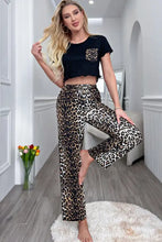 Black lettuce trim cropped t-shirt with leopard print pocket and matching wide-leg leopard pants lounge set with short sleeve length