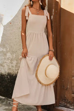 Light beige tie shoulder smocked tiered maxi dress with ruffles and bows