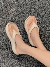 Light beige toe post platform slippers with thick contoured soles