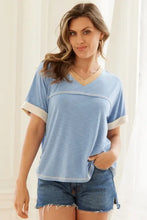Light blue short sleeve t-shirt with contrast trim short details and denim shorts