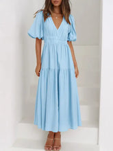 Light blue puff sleeve midi dress with v-neckline