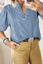 Light blue denim blouse with V-neck, puff sleeve and short sleeve length