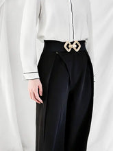 Black high-waisted pants with gold geometric buckle elastic wide belt