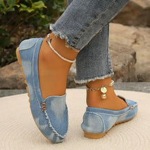 Light blue denim round toe flat loafers with frayed edges, buckle and pearl anklet