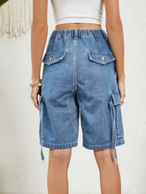 Light blue elastic waist denim shorts with buttoned cargo pockets