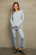 Light blue Mandy buttoned hem ribbed long sleeve knit top with distressed jeans and black sandals
