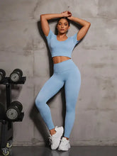 Light blue ribbed round neck short sleeve crop top and leggings set with moderate stretch