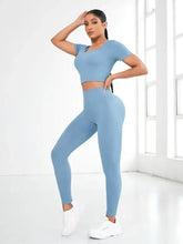 Light blue ribbed round neck short sleeve crop top and leggings set with white sneakers