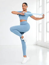 Light blue ribbed round neck short sleeve crop top and leggings set with white sneakers for fitness