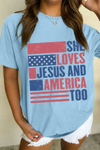 Light blue round neck short sleeve t-shirt with distressed flag graphic