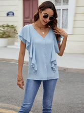 Light blue ruffled buttoned blouse for women with short sleeves