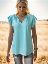 Light blue ruffled notched cap sleeve tank with V-neck