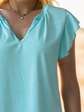 Light blue ruffled notched cap sleeve tank with V-neck and necklace