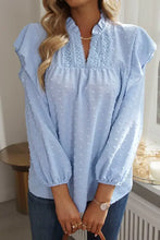 Light blue swiss dot ruffled long sleeve blouse with embroidered V-neck