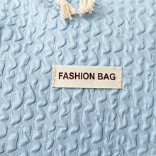 Light Blue Textured Duffel and Tote Travel Bag with White Straps Travel Bags