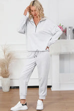 White half zip sweatshirt with long sleeve length and drawstring sweatpants set