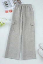 Light gray drawstring active pants with wide-leg cargo pockets