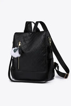 Light gray zipper backpack with black textured fur charm and adjustable straps