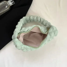 Mint green quilted small texture handbag with white lining and silver hardware