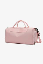 Light pink nylon crossbody duffel bag with top handles and strap
