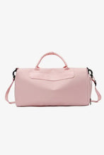 Light pink nylon crossbody duffel bag with top handles and strap