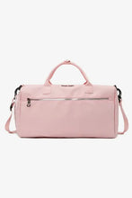 Light pink nylon crossbody duffel bag with top handles and strap