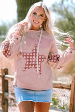 Woman in light pink star long sleeve hoodie and denim mini skirt