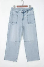 Light wash utility pocket straight leg jeans with wide-leg cut frayed hems and subtle knee distressing