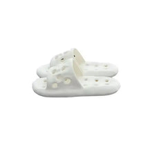 Pair of white perforated open toe flats slippers