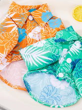 Lightweight pet top in monstera leaf print, orange-green basic style with snap closures