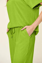 Lime green textured short sleeve texture round neck top and wide leg pants set