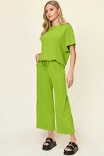 Lime green short sleeve texture round neck top with wide leg pants