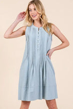 Light blue sleeveless midi dress with denim pintuck detail and button-front neckline by Lime N Chili