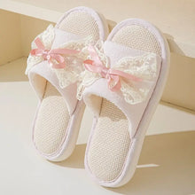 White lace open toe flats with pink bow on linen material