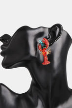 Sparkling red lobster shape glass stone dangle earring on mannequin ear